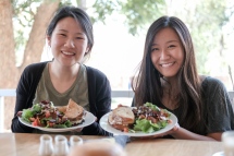 Ivanna (left) and Josephine (right) pose with their sandwiches and salads